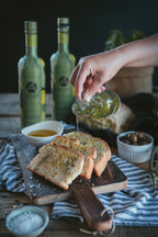 Greek olive oil poured over toasted bread